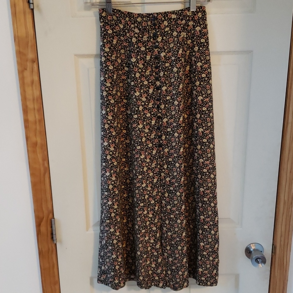 Long flower print skirt.   Has buttons in front